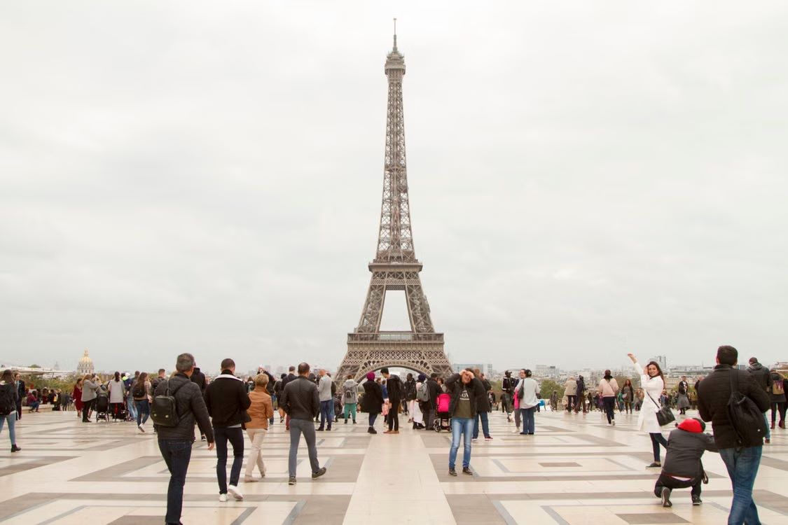 Visitors enjoying the Eiffel Tower in Paris